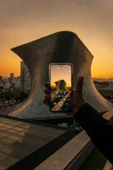 A breathtaking view of Museo Soumaya captured with a smartphone at sunset in Mexico City.